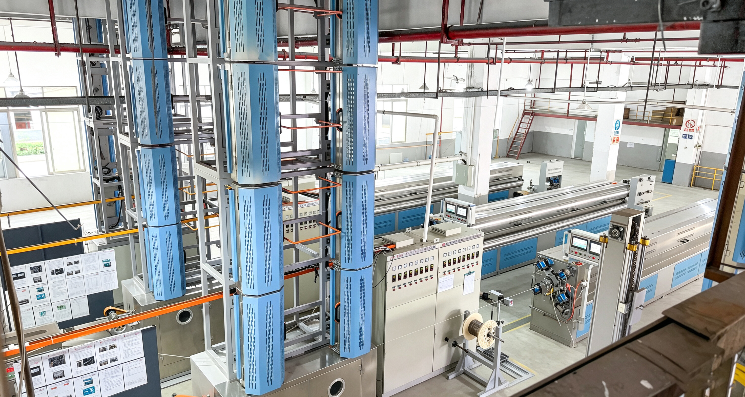 High-Angle View: Blue Sintering Tower and Control Cabinet